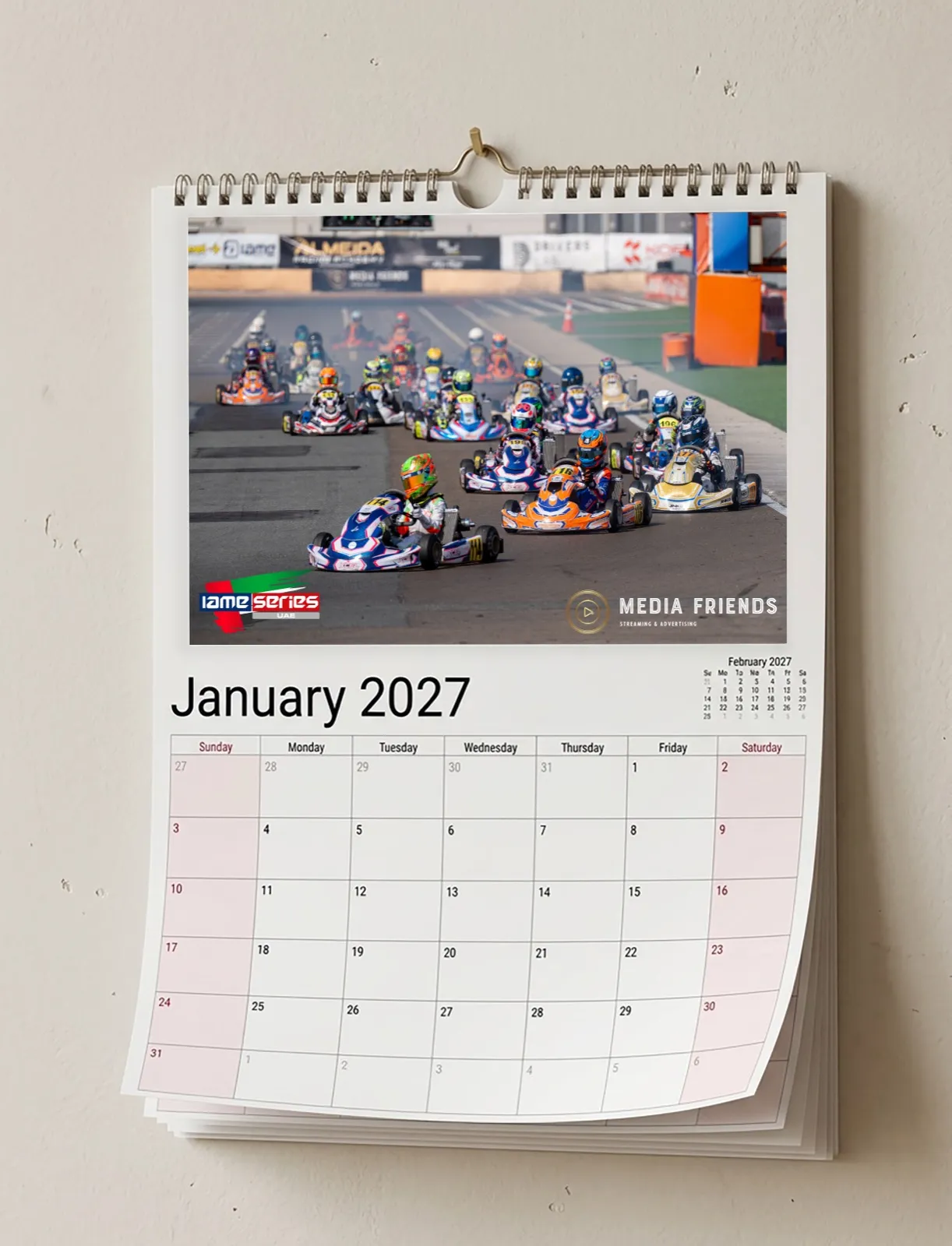 A4 wall calendar open on January, showing a karting grid at the start of a race
